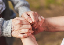 niece holding granny's hands