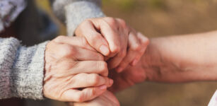 niece holding granny's hands